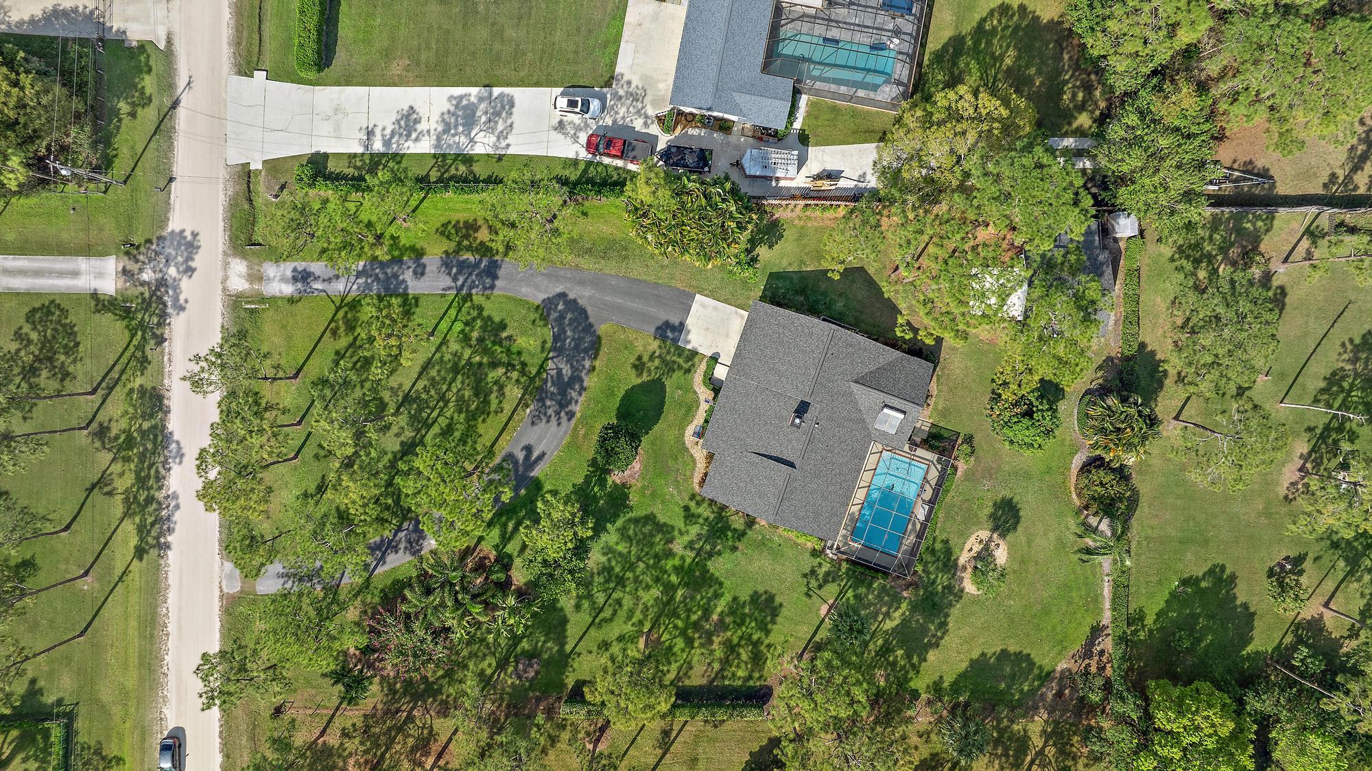 16800 128th Trail North Jupiter, FL 33478 - Photo 38 of 52 an aerial view of a house with a yard