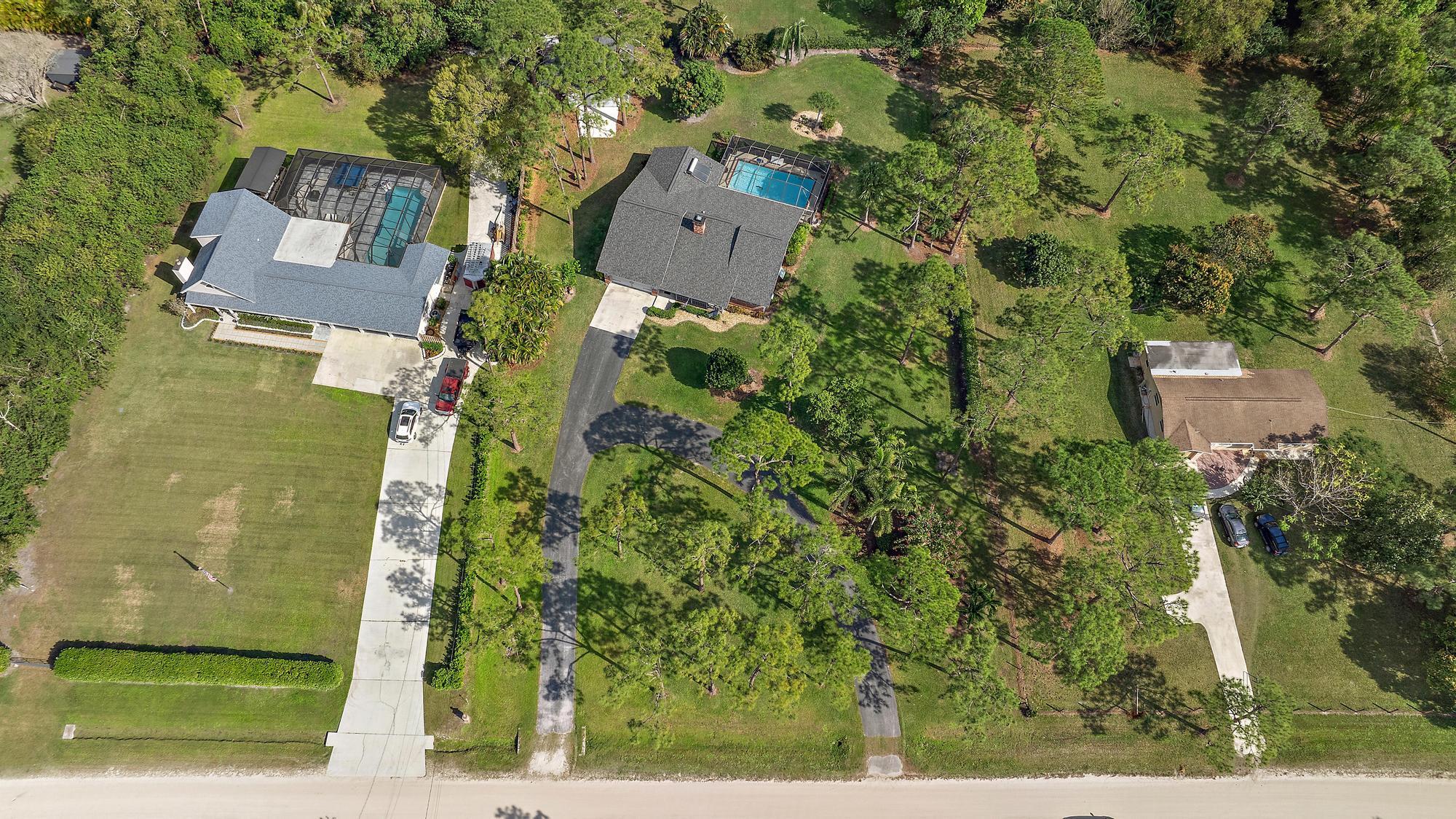 16800 128th Trail North Jupiter, FL 33478 - Photo 39 of 52 an aerial view of a house with a yard