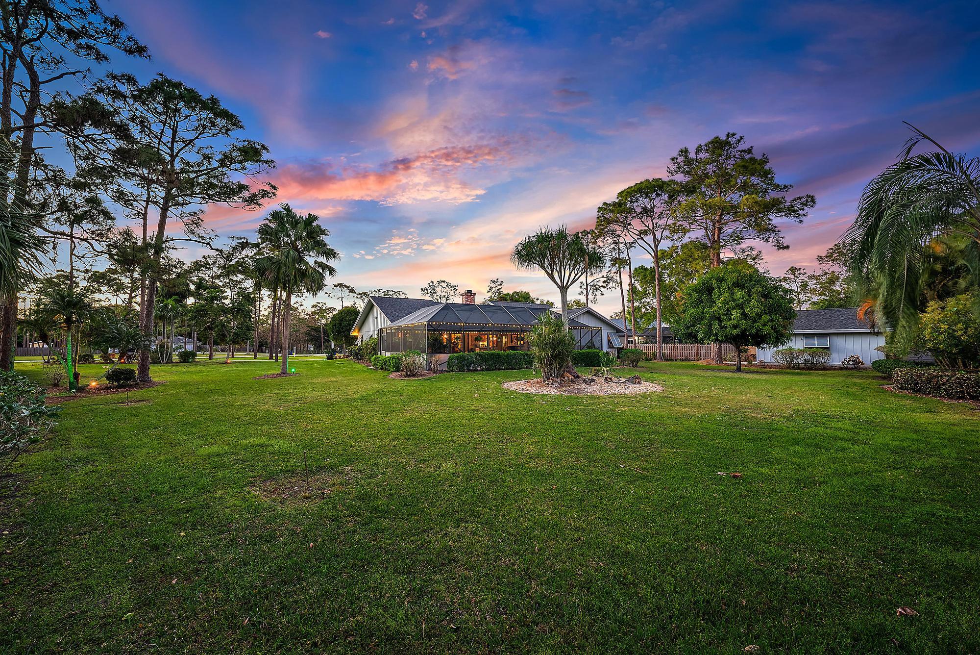 16800 128th Trail North Jupiter, FL 33478 - Photo 4 of 52 a view of a house with a big yard