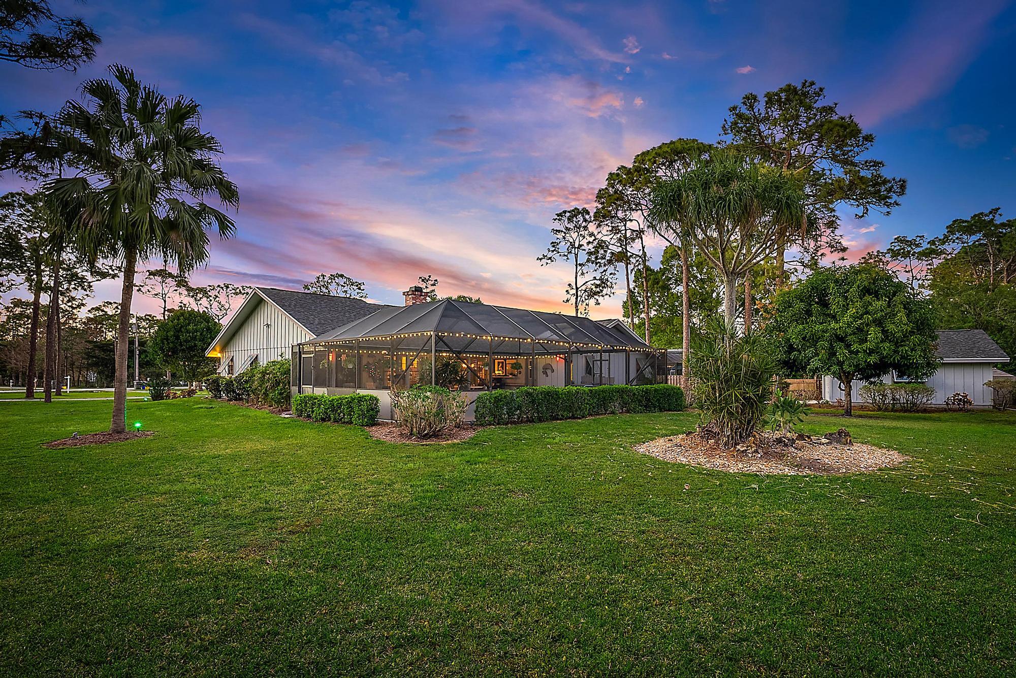 16800 128th Trail North Jupiter, FL 33478 - Photo 47 of 52 a front view of a house with a garden