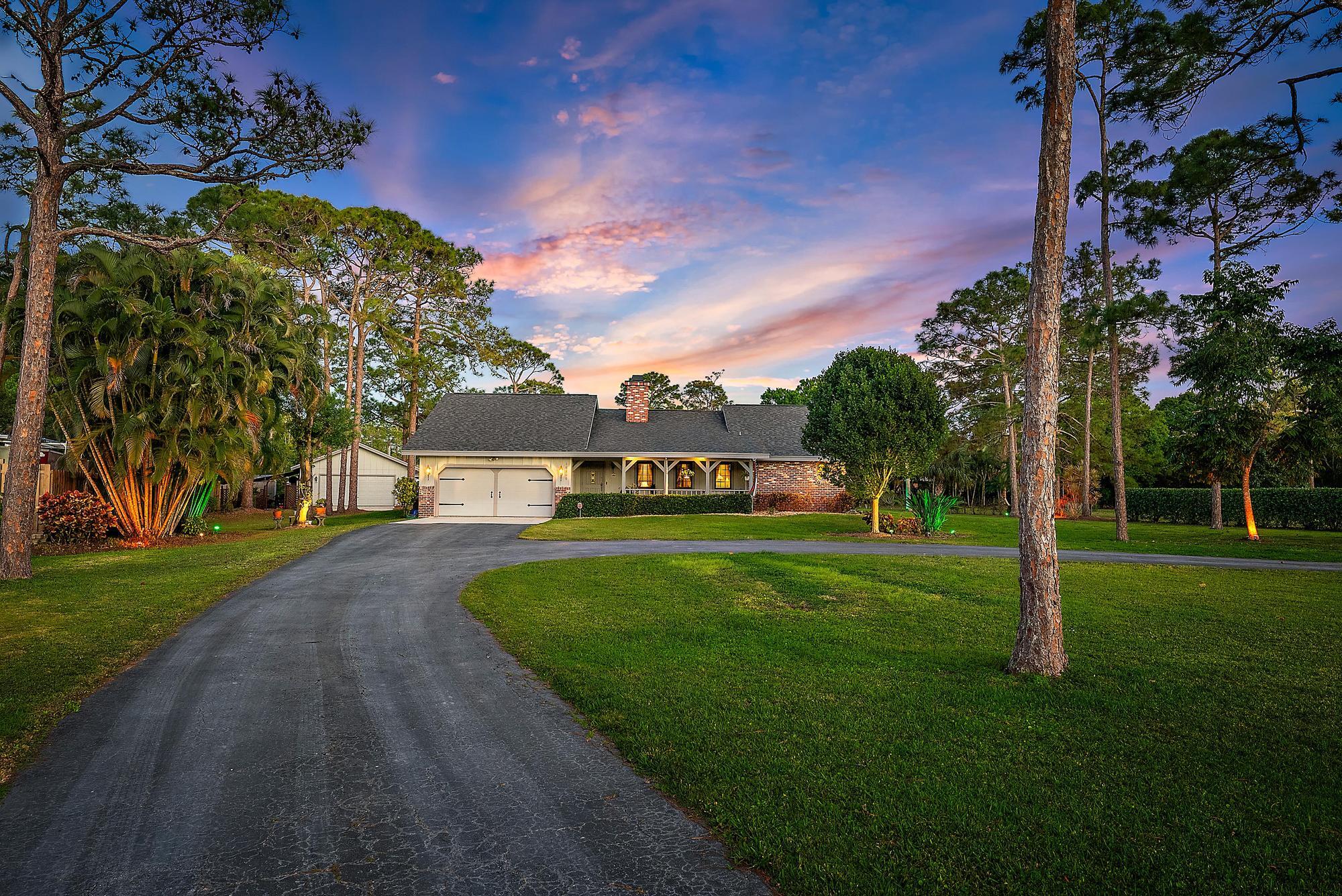 16800 128th Trail North Jupiter, FL 33478 - Photo 50 of 52 a view of a house with a big yard