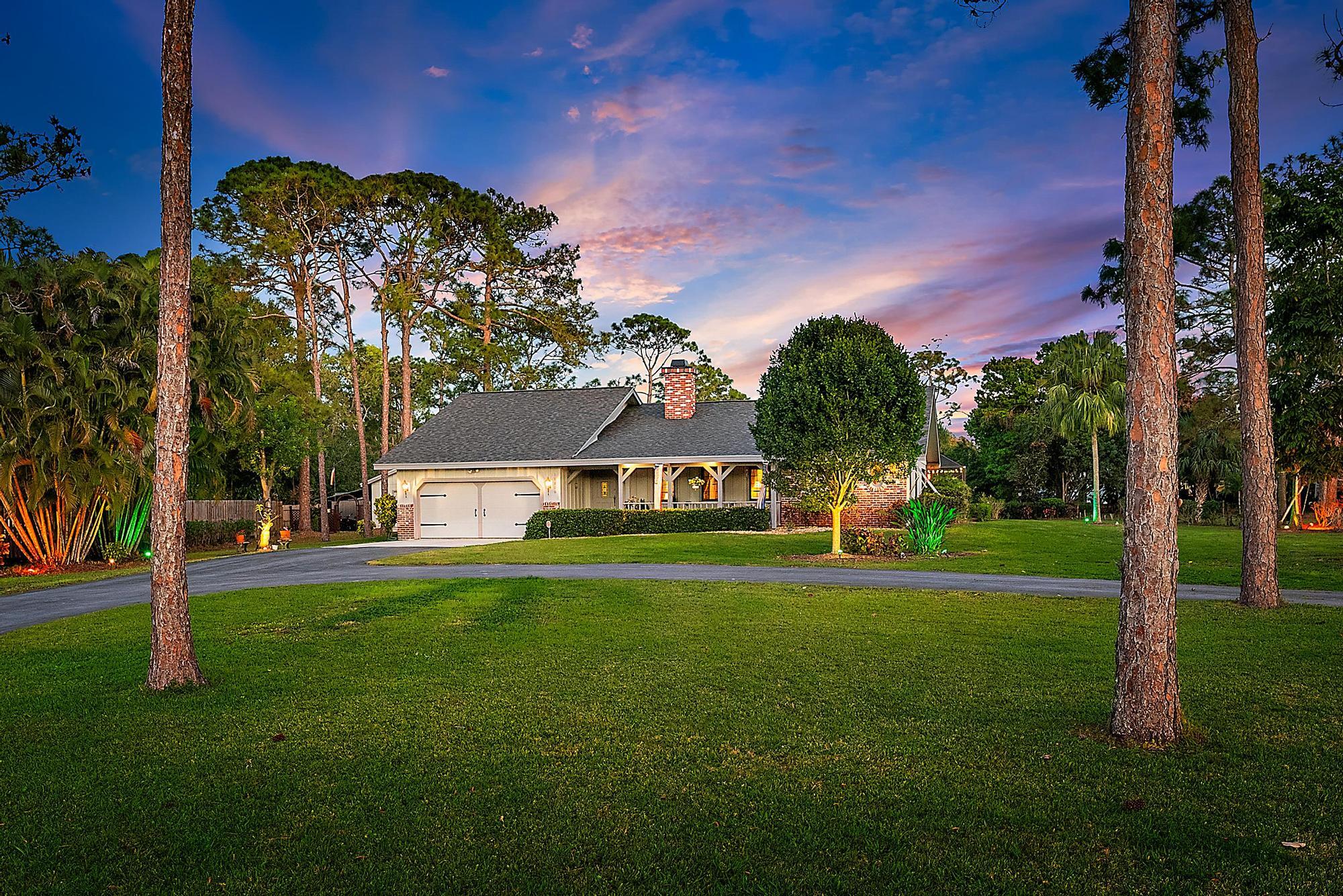 16800 128th Trail North Jupiter, FL 33478 - Photo 51 of 52 a view of a house with a big yard