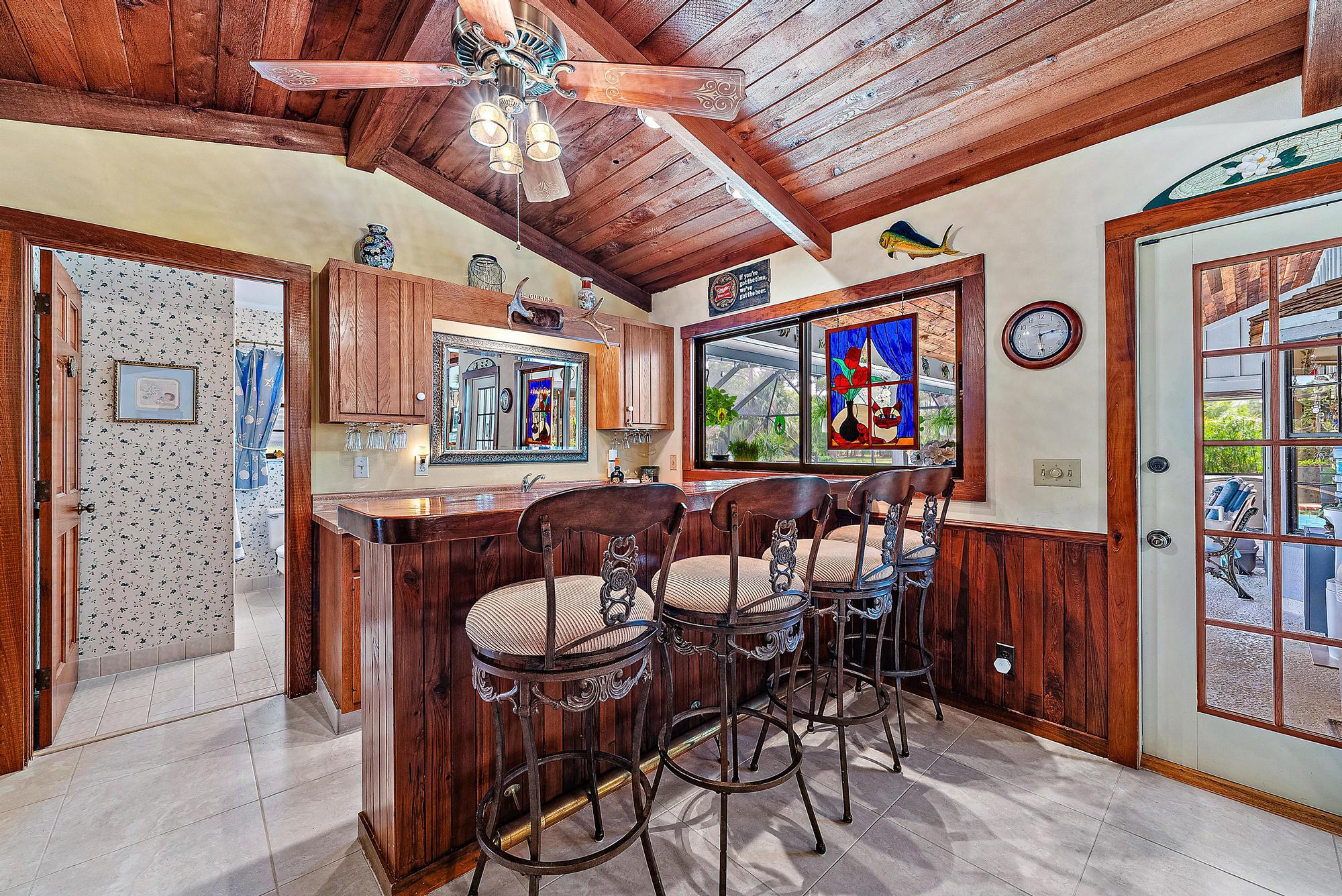 16800 128th Trail North Jupiter, FL 33478 - Photo 9 of 52 a view of a dining room with furniture window and wooden floor