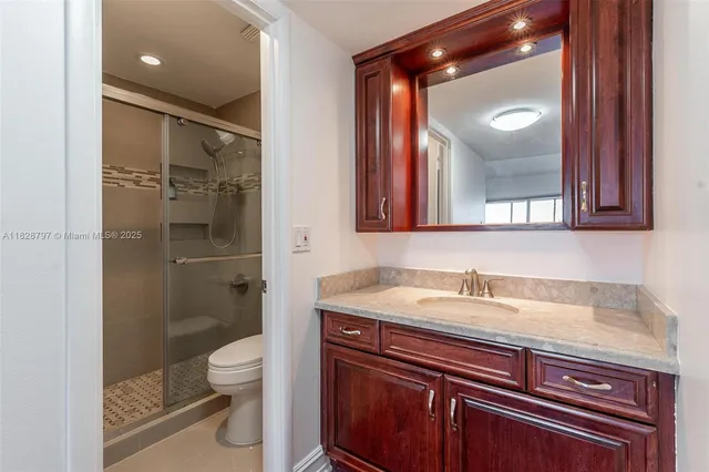 a bathroom with a glass shower door