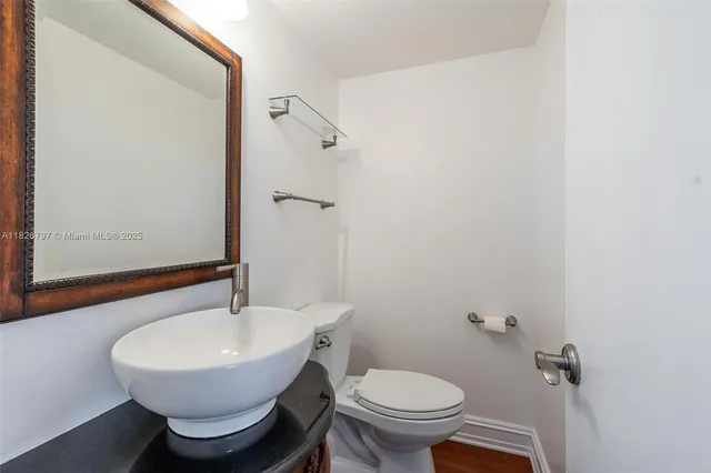 a kitchen with a sink and a refrigerator