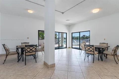 a view of a swimming pool with lounge chairs