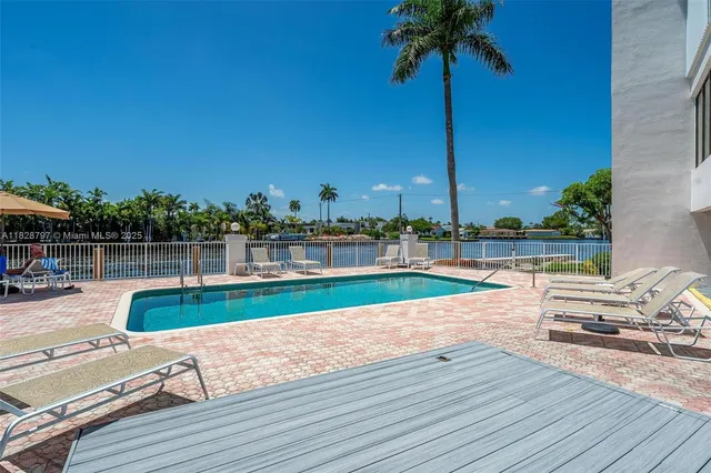 a view of a lake with houses in the back