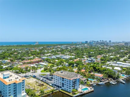 an aerial view of a city with ocean view