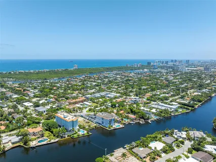an aerial view of a city with a lake view