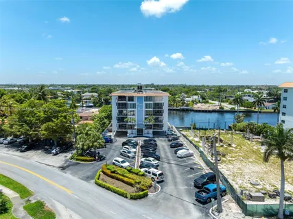 a view of kitchen with stainless steel appliances a refrigerator and a stove top oven