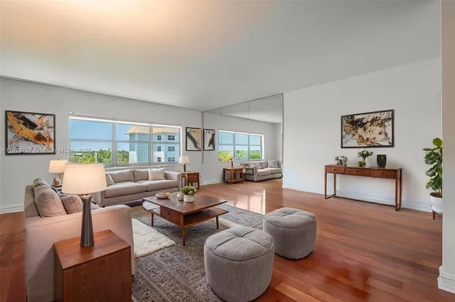 a living room with furniture and a table