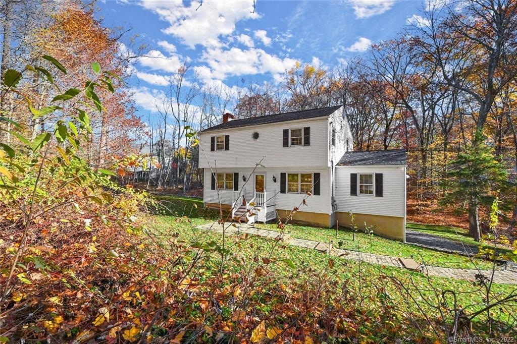 144 Fieldcrest Drive Ridgefield, CT 06877 - Photo 1 of 1 a view of a house with backyard and sitting area
