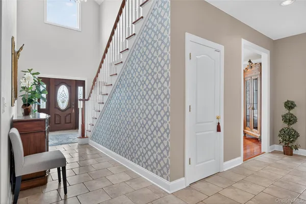 a view of a hallway with seating area