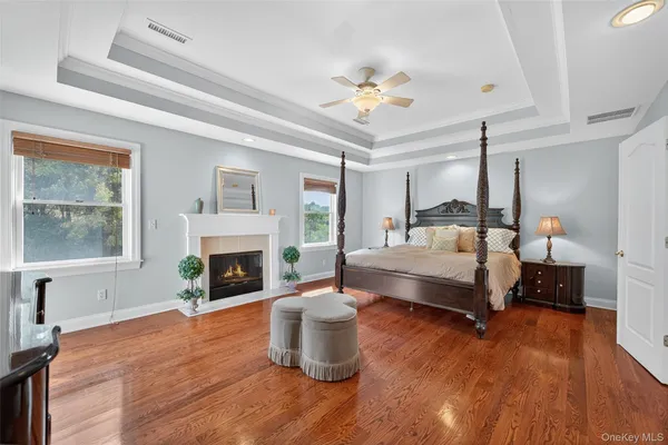 a bedroom with a bed and a fireplace