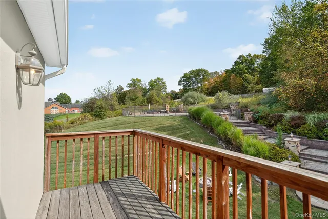 a front view of a house with a yard table and chairs