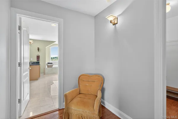 a view of a hallway with livingroom and painted walls
