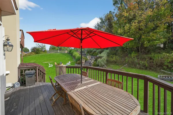 a view of balcony with outdoor seating and yard