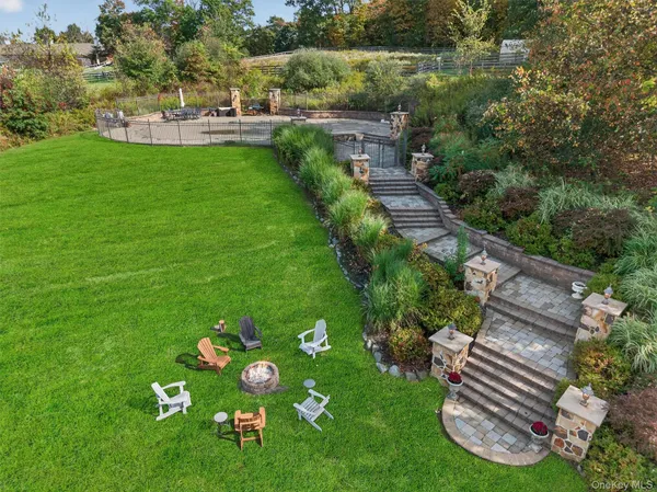 a view of a table and chairs in the garden
