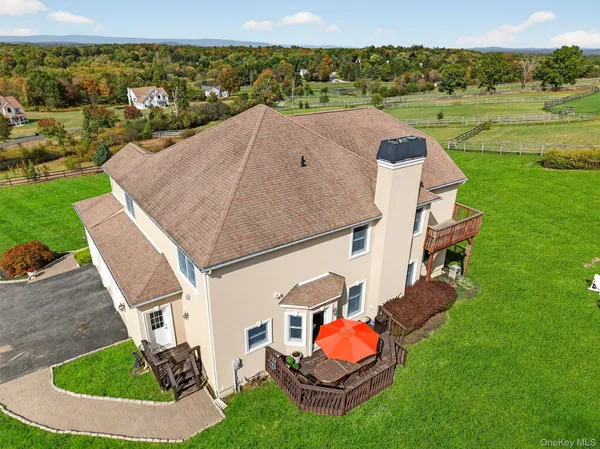 an aerial view of a house with outdoor space