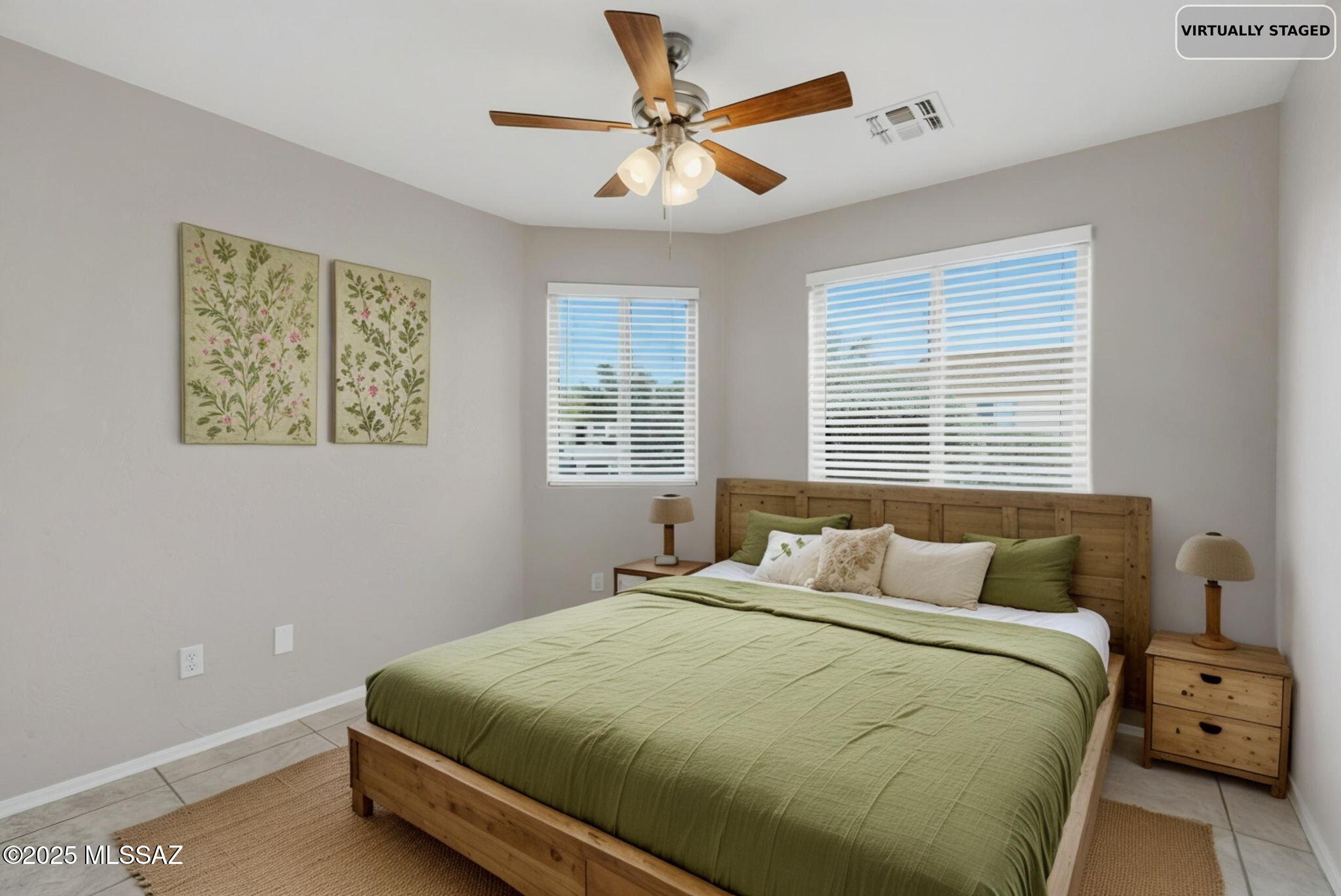 8244 South Lost Mountain Road Tucson, AZ 85747 - Photo 33 of 41 a bedroom with a bed and window