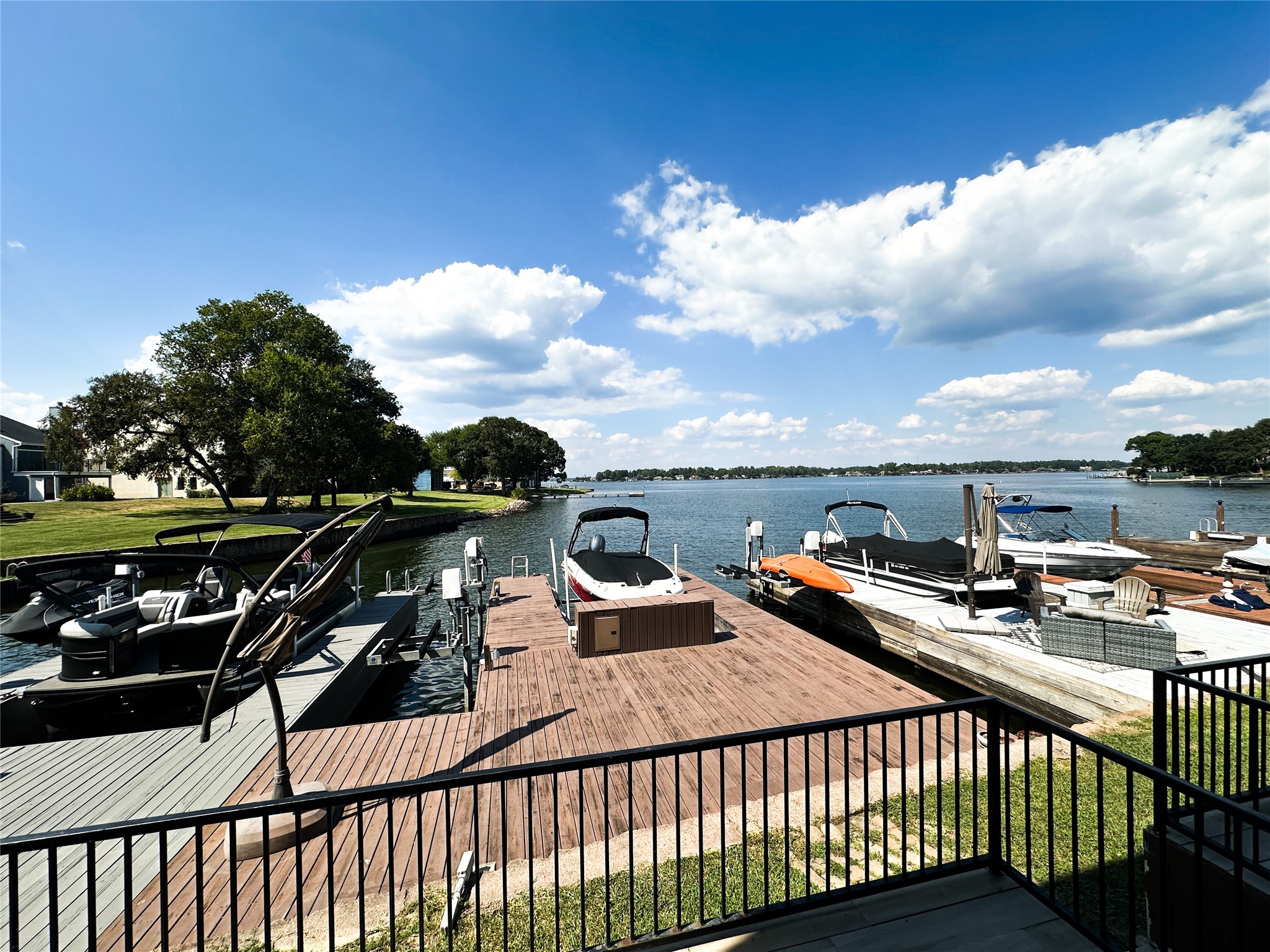 a roof deck with table and chairs