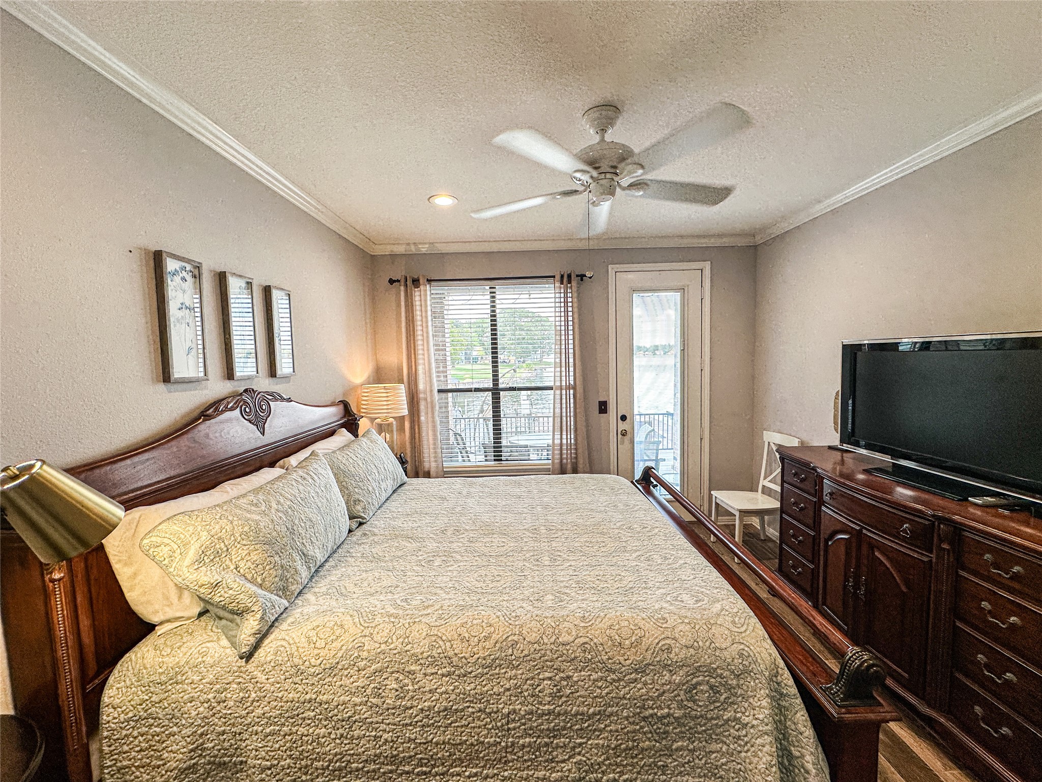 11471 Ketch Court Willis, TX 77318 - Photo 12 of 33 a bedroom with a bed and a flat screen tv
