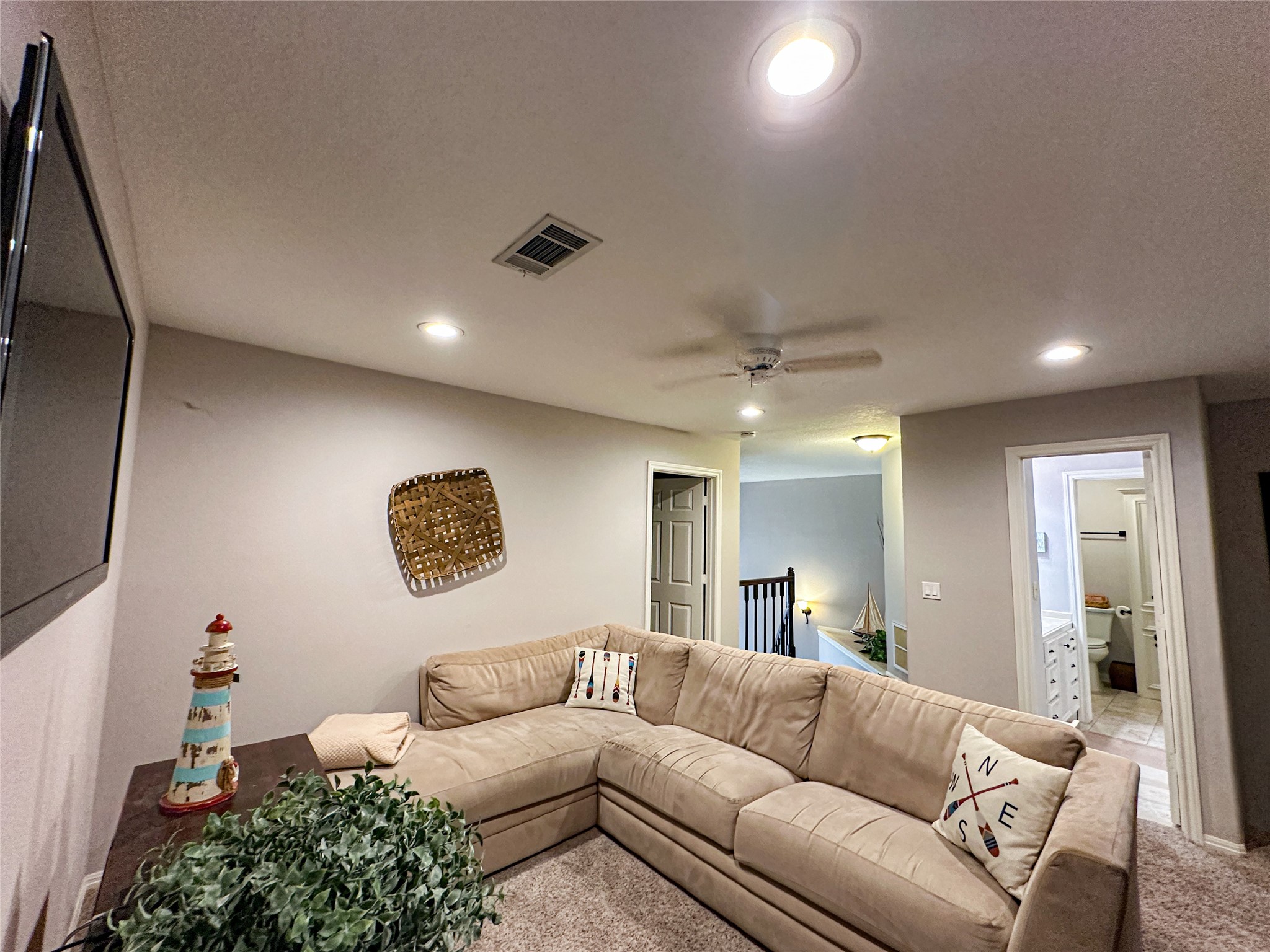 11471 Ketch Court Willis, TX 77318 - Photo 17 of 33 a living room with furniture and a flat screen tv