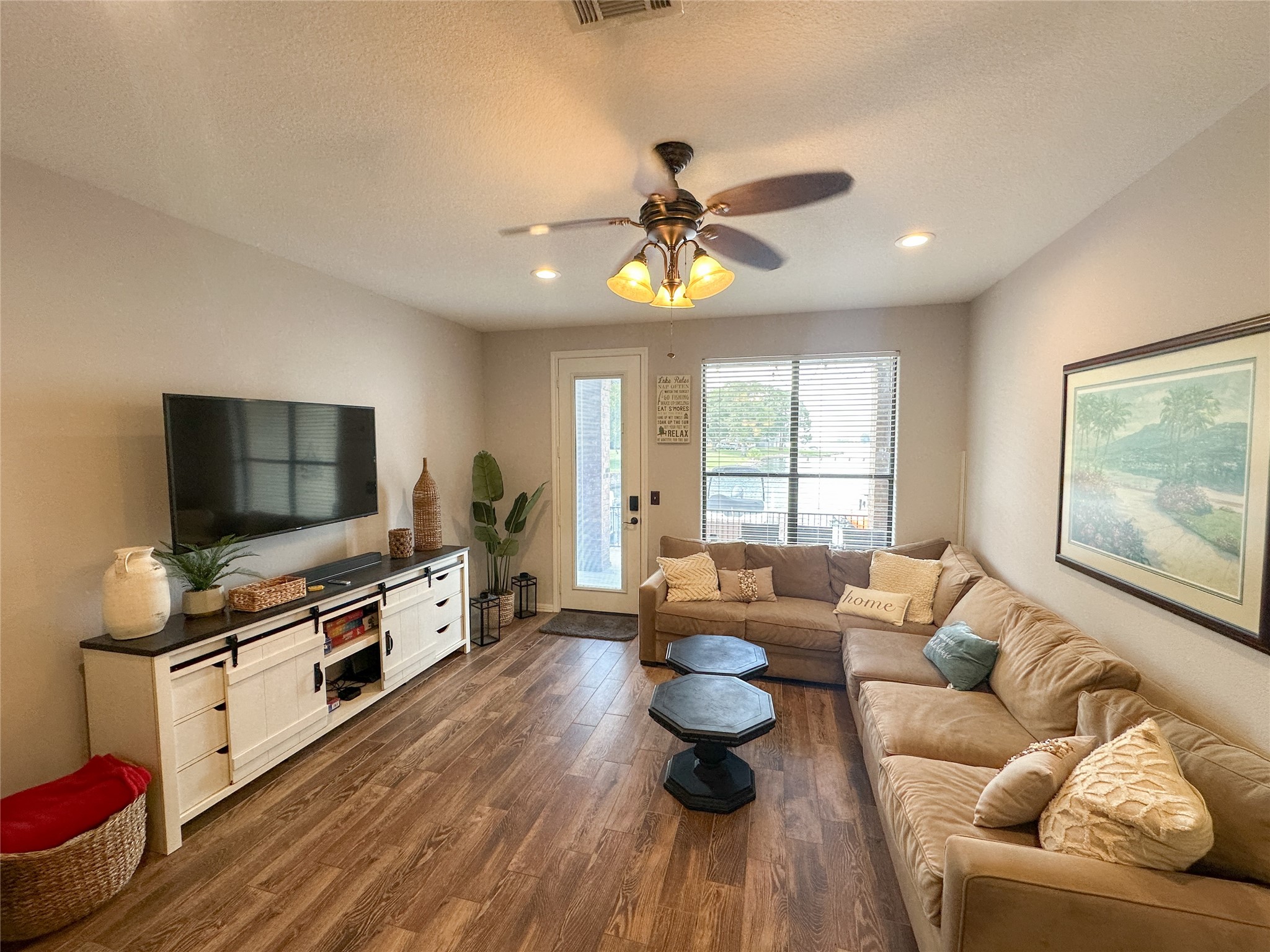 11471 Ketch Court Willis, TX 77318 - Photo 7 of 33 a living room with furniture and a flat screen tv