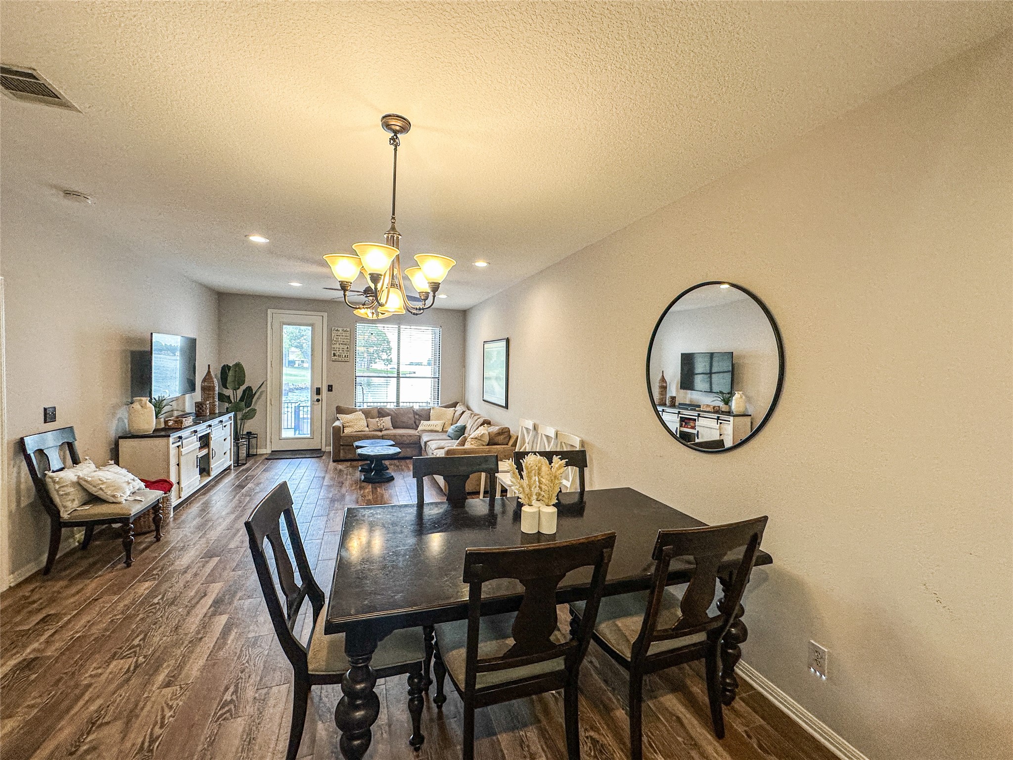 11471 Ketch Court Willis, TX 77318 - Photo 9 of 33 a view of a dining room with furniture and chandelier