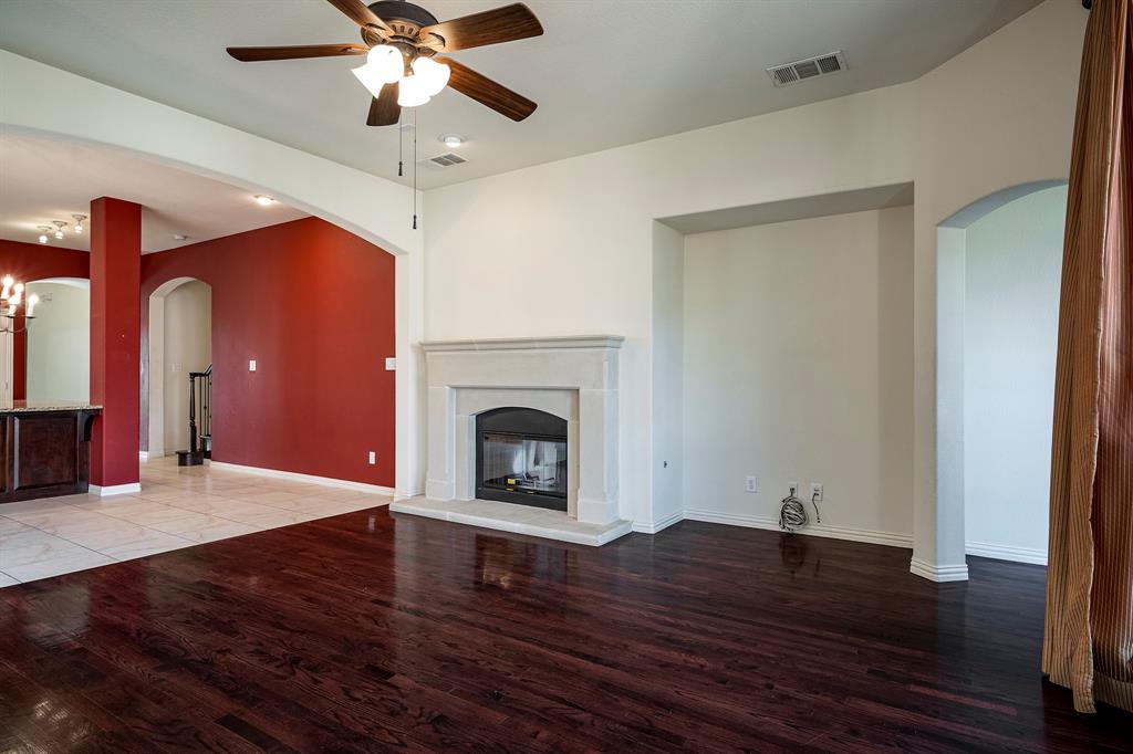 1138 Amy Drive Allen, TX 75013 - Photo 14 of 26 a view of empty room with wooden floor and fan