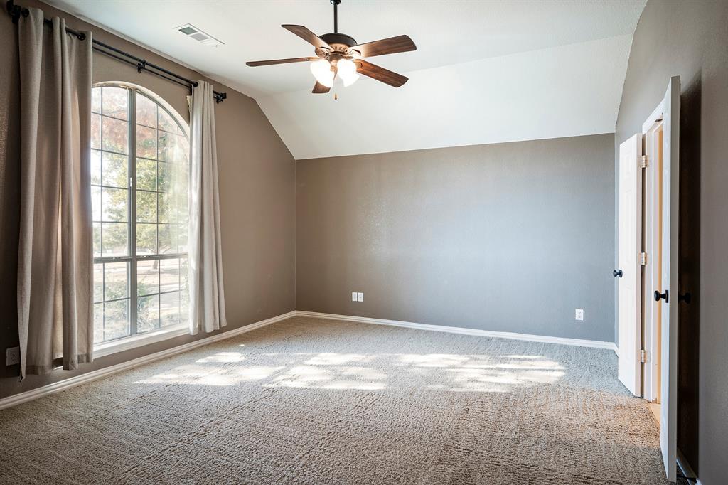 1138 Amy Drive Allen, TX 75013 - Photo 15 of 26 an empty room with windows and fan