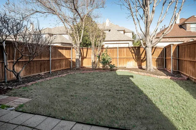 a view of a house with a yard and large window