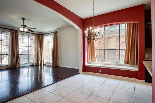 a large kitchen with stainless steel appliances granite countertop a stove and a sink