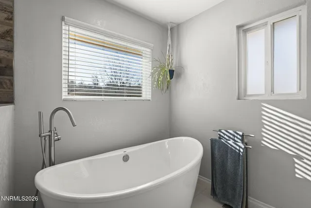 a white bath tub sitting in a bathroom