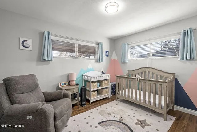 a bedroom with furniture and a window