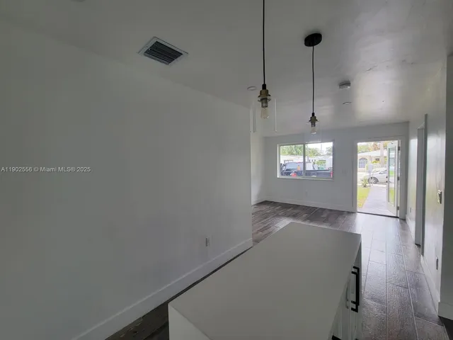 a view of an empty room and window