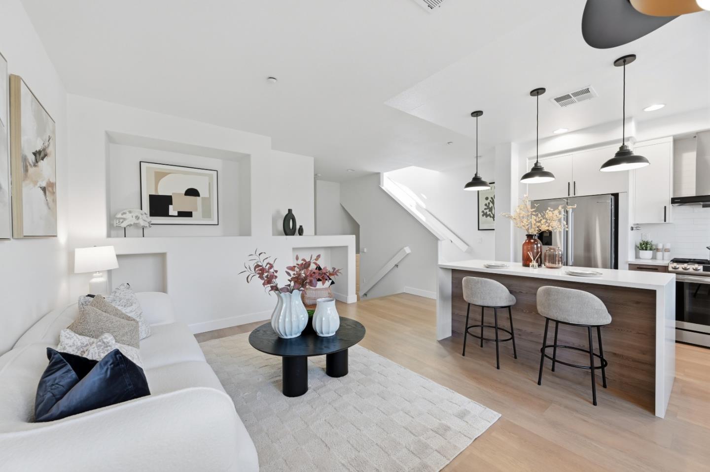 35005 11th Street Union City, CA 94587 - Photo 22 of 80 a living room with furniture and a wooden floor