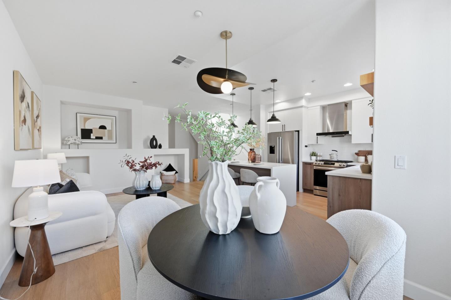 35005 11th Street Union City, CA 94587 - Photo 30 of 80 a living room with furniture kitchen view and a chandelier