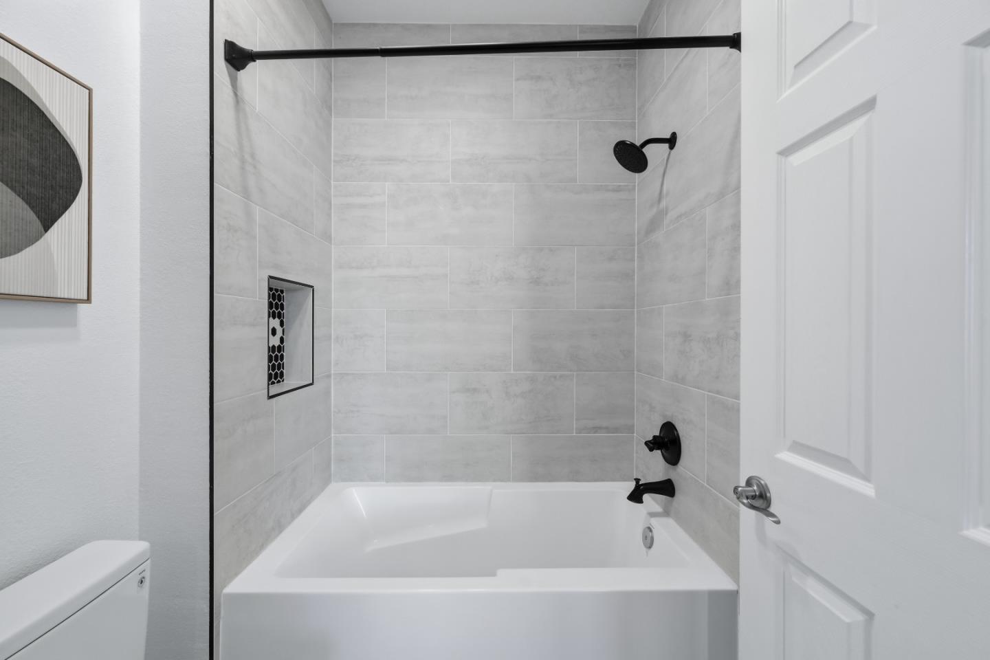 35005 11th Street Union City, CA 94587 - Photo 54 of 80 a bathroom with a bathtub and a shower