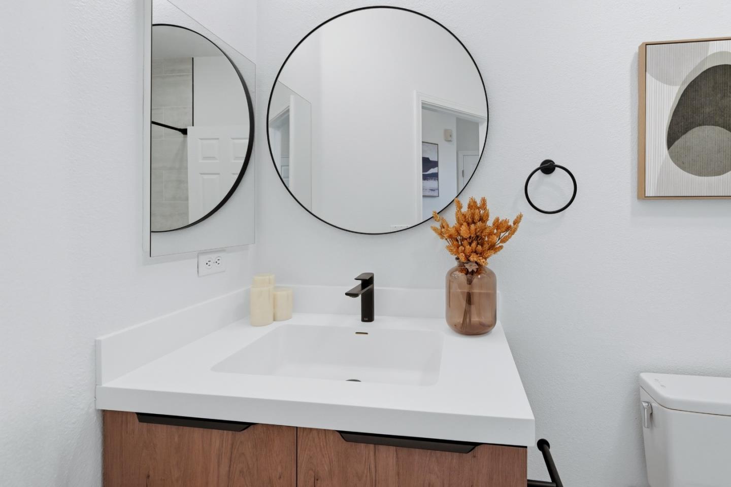35005 11th Street Union City, CA 94587 - Photo 55 of 80 a bathroom with a sink mirror and toilet