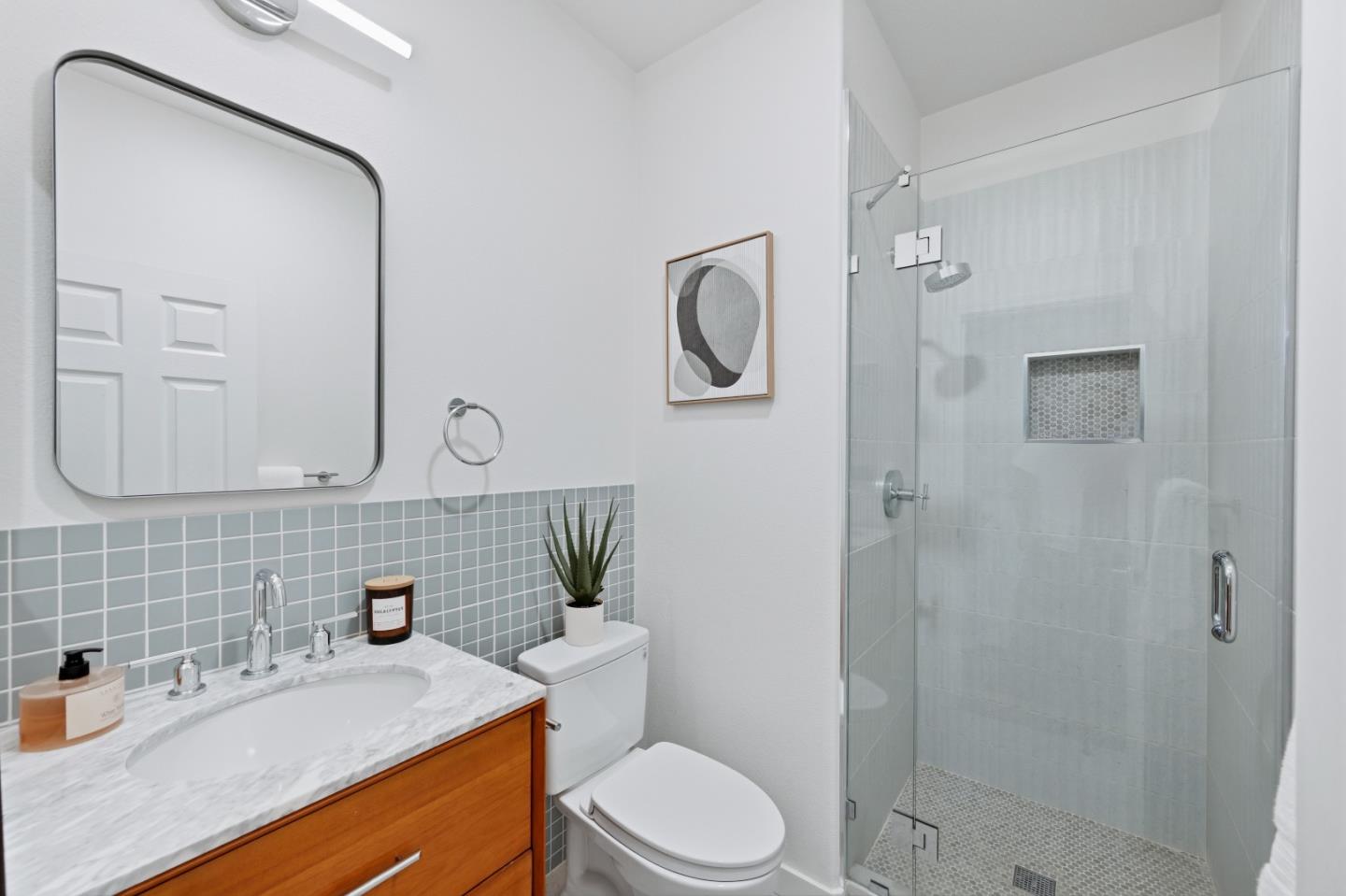 35005 11th Street Union City, CA 94587 - Photo 72 of 80 a bathroom with a sink a toilet and shower