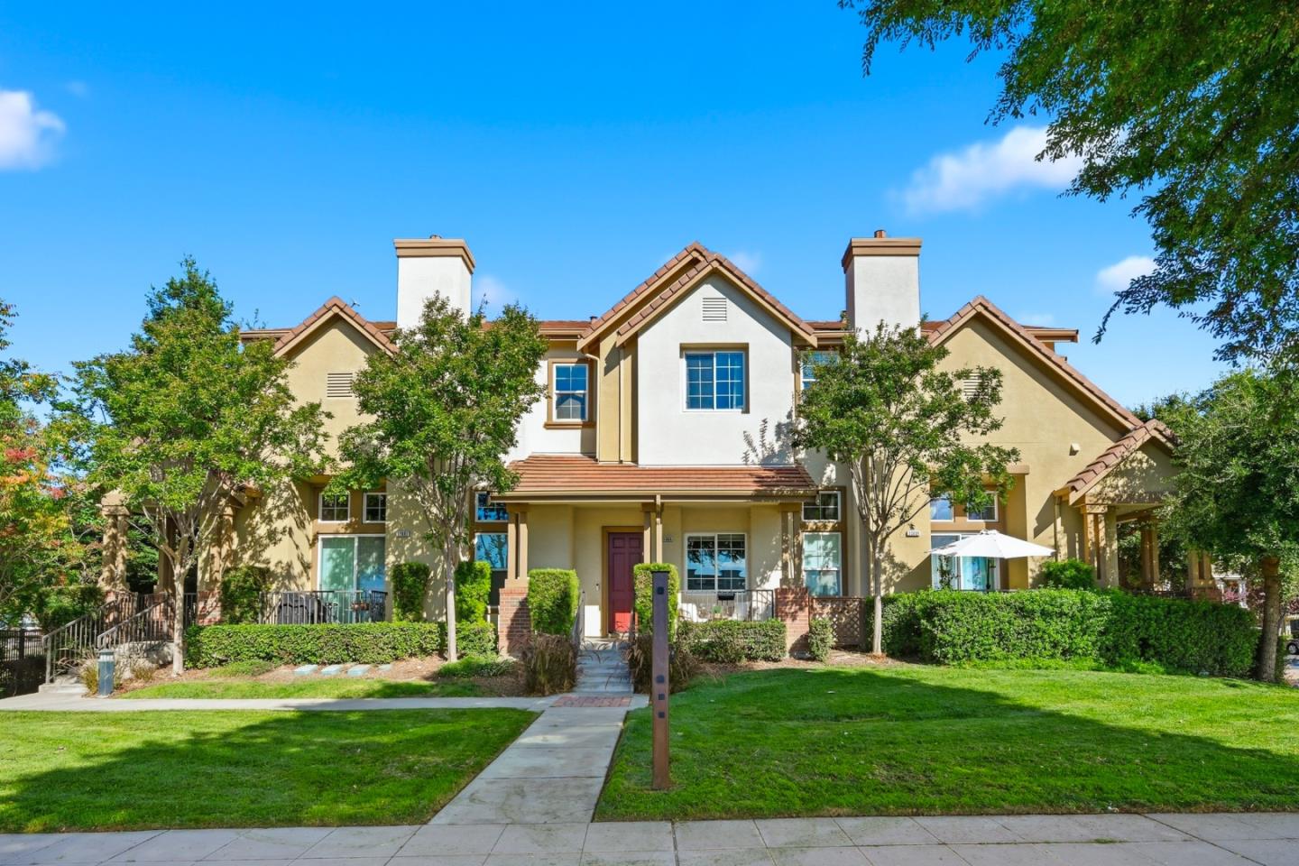 35005 11th Street Union City, CA 94587 - Photo 75 of 80 a front view of a house with a yard table and chairs