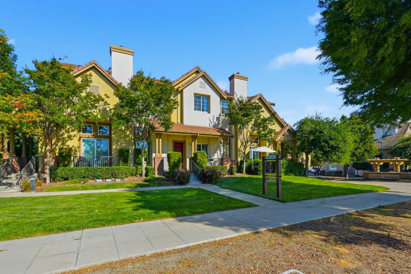 35005 11th Street Union City, CA 94587 - Photo 76 of 80 a view of a white house with a big yard and large trees