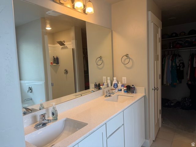 437 North 650 E Street Springville, UT 84663 - Photo 10 of 11 Double vanity with integrated sinks and a speckled countertop