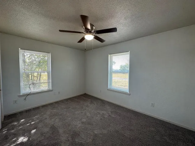 a view of empty room with windows