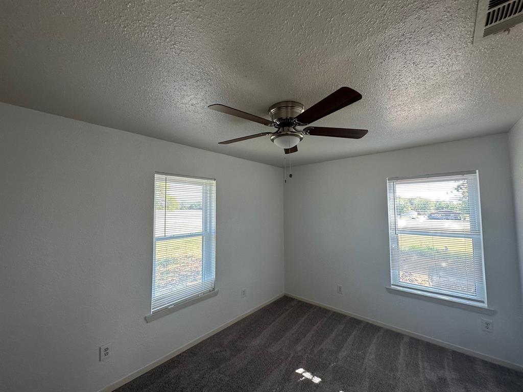 2520 County Road 406 McKinney, TX 75071 - Photo 7 of 19 an empty room with windows and fan