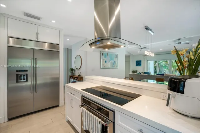 a kitchen with a refrigerator and countertop