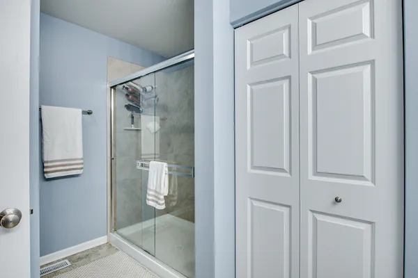 a living room with furniture a table and a wooden floor