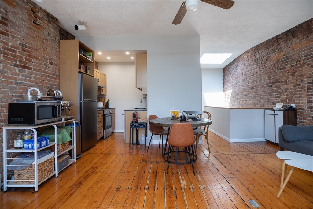 75 Chandler Street, Unit 7 Boston, MA 02116 - Photo 2 of 11 a dining room with furniture and wooden floor