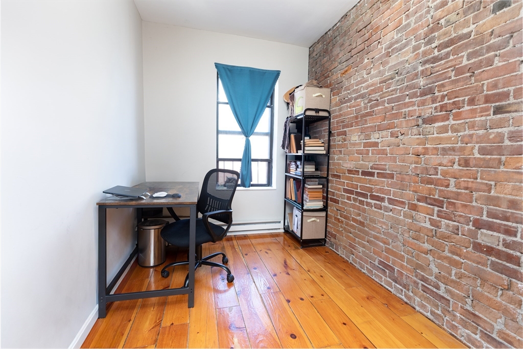 75 Chandler Street, Unit 7 Boston, MA 02116 - Photo 7 of 11 a workspace room with furniture and wooden floor